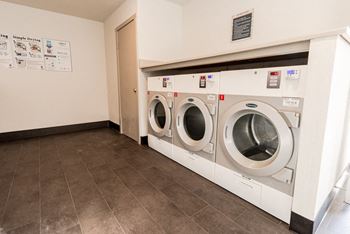 a washer and dryer in a laundry room with a door